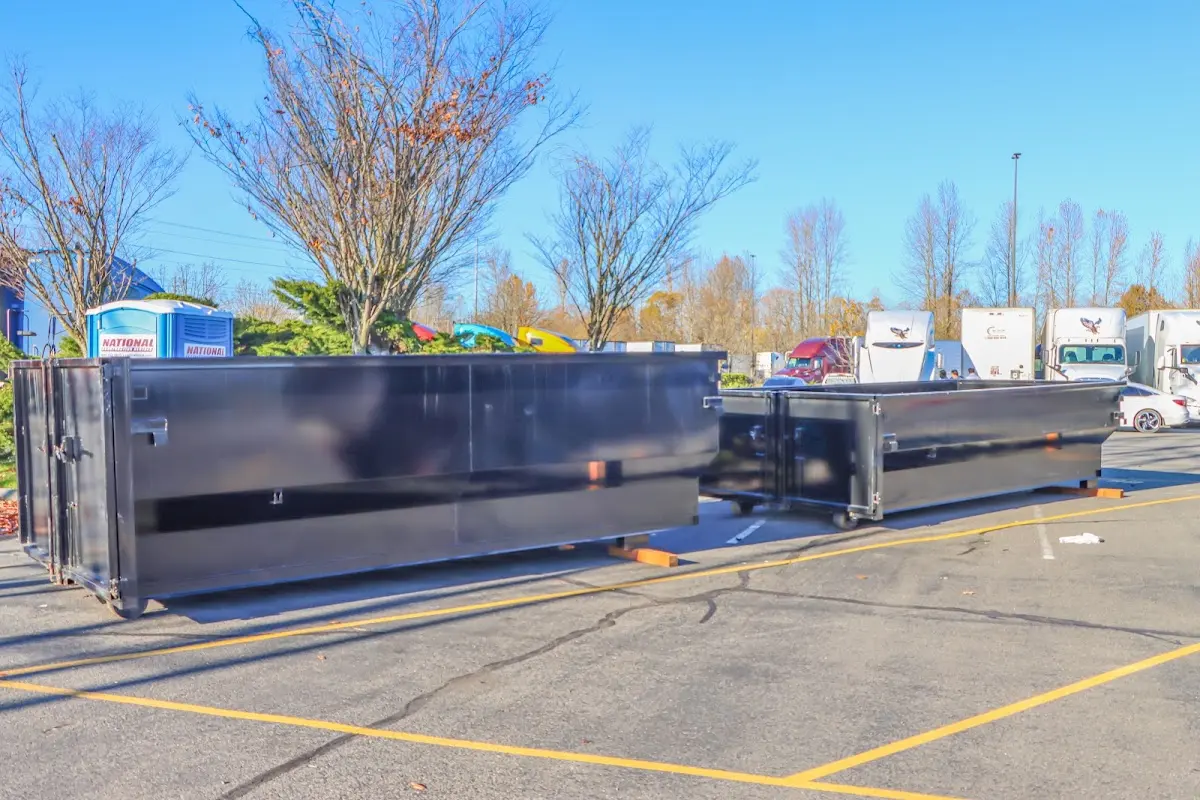 Professional dumpster rental service with roll-off container on residential driveway in Healdsburg